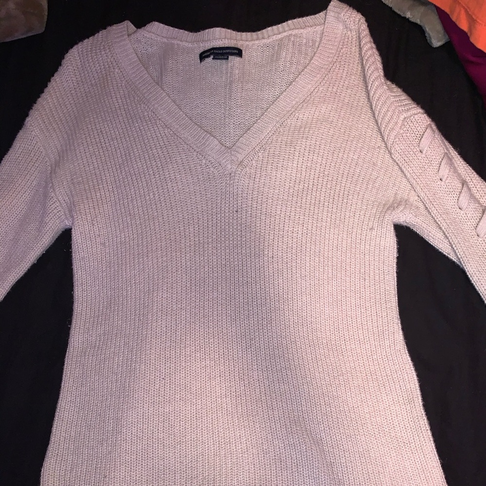 Sweater with twisted sleeves